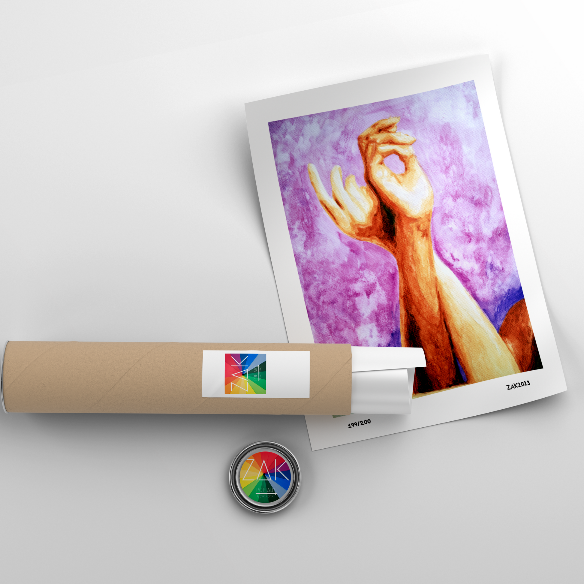 Art print of a hand with a purple background, wrapped in paper with a colorful logo, on a light gray surface.