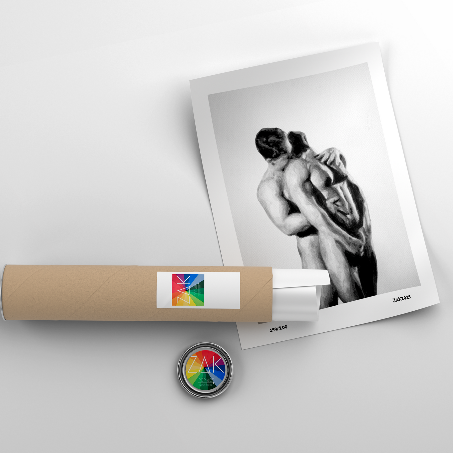 Roll of paper with a colorful label, a framed black and white photo, and a round button on a light gray background.