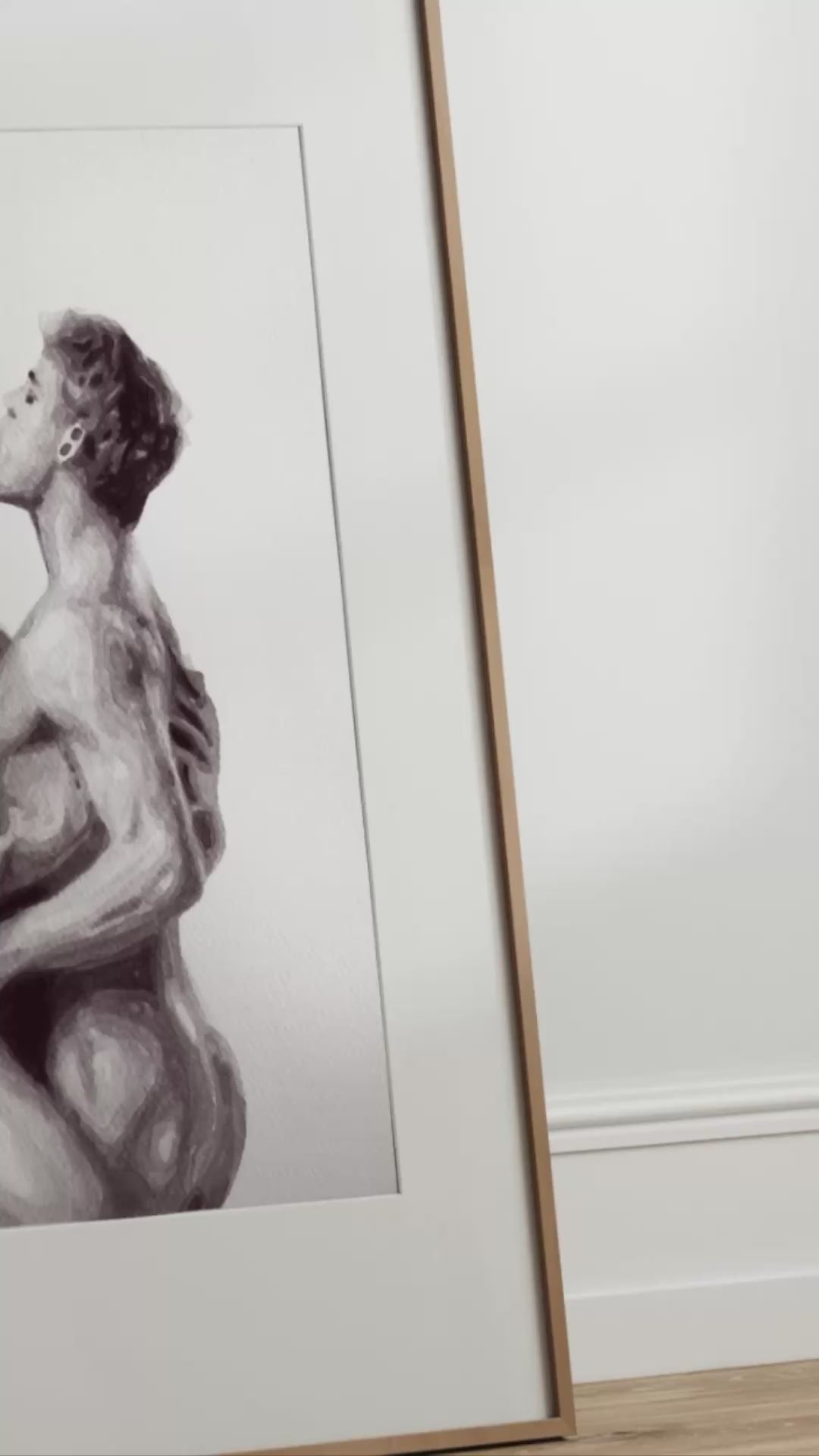 video artwork of two nude figures embracing on a white background
