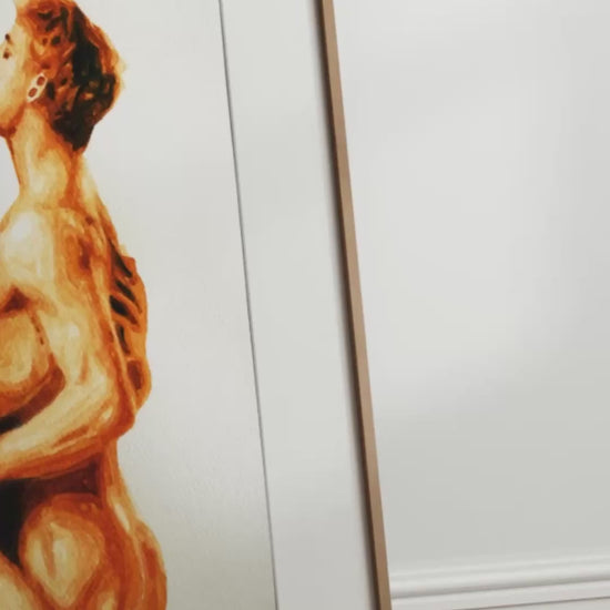 video artwork of two nude figures embracing on a white background

