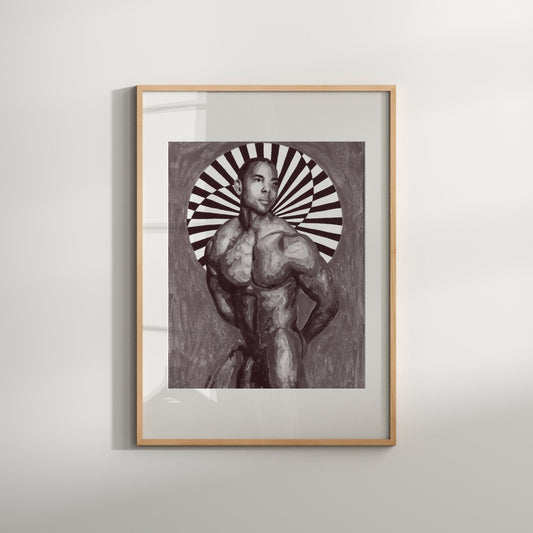 This image features a striking limited edition photo of a nude male, presented in a black and white color scheme that enhances the artistic details. The subject is depicted in a dynamic, circular frame with a background pattern, adding to the visual impact.
